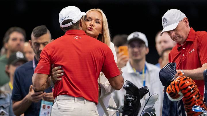 Tiger Woods gets a hug and kiss from Vanessa Trump before match against Los Angeles Golf Club. Tiger Woods gets a hug and kiss from Vanessa Trump before match against Los Angeles Golf Club.