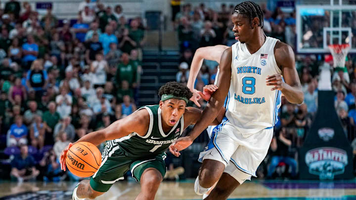 Michigan State Spartans guard Jeremy Fears Jr. (1) drives to the basket as North Carolina Tar Heels forward Caleb Wilson (8) guards him during the second half of the Fort Myers Tip-Off Beach Division game at Suncoast Credit Union Arena on Fort Myers, Fla., on Thursday, Nov. 27, 2025.
