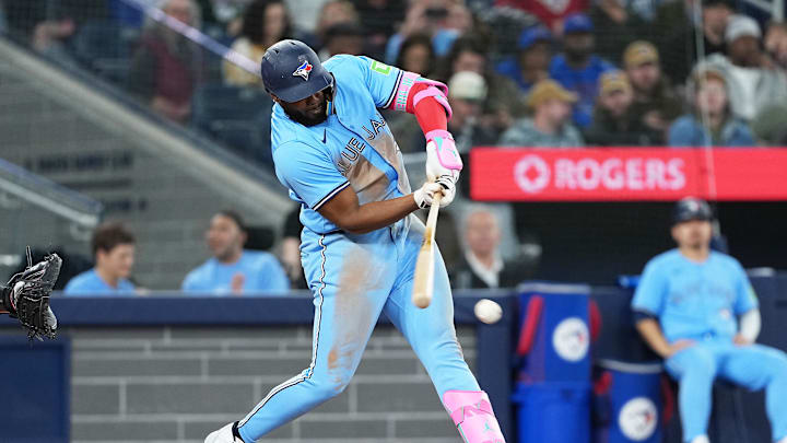 Vladimir Guerrero Jr. swings against the Nationals.