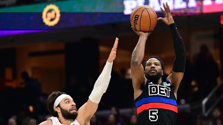 Jan 27, 2025; Cleveland, Ohio, USA; Detroit Pistons guard Malik Beasley (5) shoots over the defense of  Cleveland Cavaliers guard Max Strus (1) during the first half at Rocket Mortgage FieldHouse. Mandatory Credit: Ken Blaze-Imagn Images