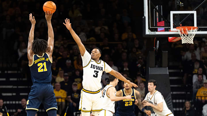 Iowa forward Cam Manyawu (3) defends a shot attempted by Michigan forward Morez Johnson Jr. (21) March 5, 2026 during a Big Ten basketball game at Carver-Hawkeye Arena in Iowa City, Iowa.