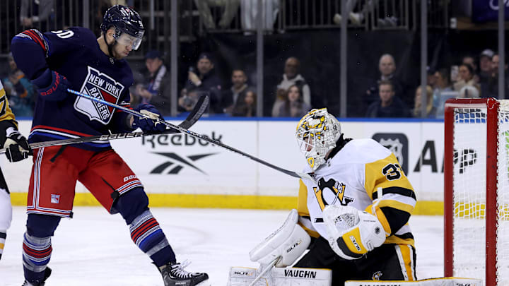 Feb 7, 2025; New York, New York, USA; Pittsburgh Penguins goaltender Alex Nedeljkovic (39) makes a save in front of New York Rangers left wing Will Cuylle (50) during the second period at Madison Square Garden. Mandatory Credit: Brad Penner-Imagn Images