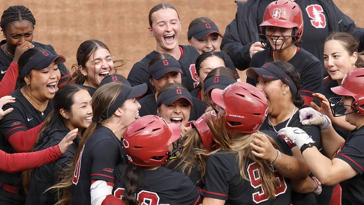 May 7, 2026; Charlottesville, VA, USA; Stanford Cardinal players celebrate after defeating the Louisville Cardinals in the eighth inning during the ACC Softball Tournament at Palmer Park. Mandatory Credit: Amber Searls-Imagn Images
