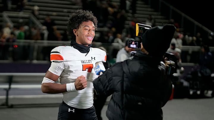 West Des Moines Valley sophomore Jayden McGregory (7) is interviewed by KCCI s Shannon Ehrhardt after the Tigers beat Waukee, 20-7, during a high school football game in Waukee on Friday, Nov. 3, 2023. West Des Moines Valley sophomore Jayden McGregory (7) is interviewed by KCCI s Shannon Ehrhardt after the Tigers beat Waukee, 20-7, during a high school football game in Waukee on Friday, Nov. 3, 2023.