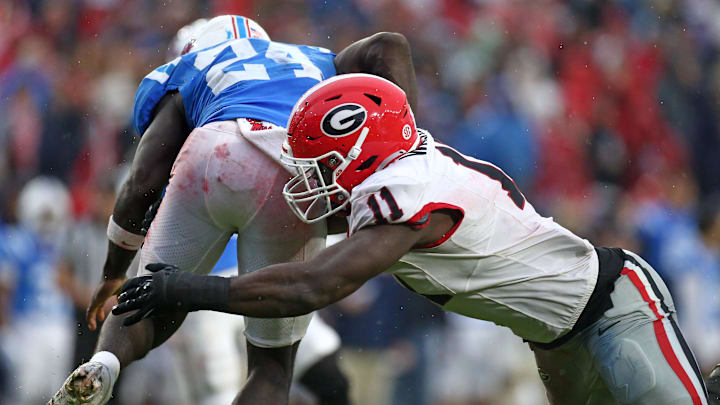 Nov 9, 2024; Oxford, Mississippi, USA; Georgia Bulldogs linebacker Jalon Walker (11) tackles Mississippi Rebels running back Ulysses Bentley IV (24) during the first half at Vaught-Hemingway Stadium. Mandatory Credit: Petre Thomas-Imagn Images