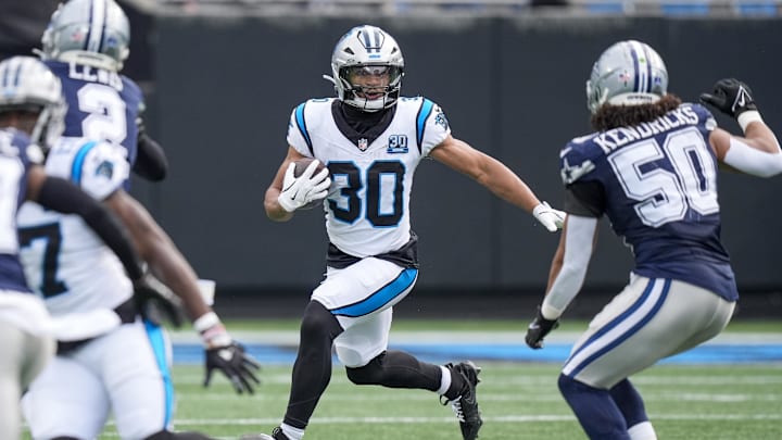 Dec 15, 2024; Charlotte, North Carolina, USA; Carolina Panthers running back Chuba Hubbard (30) runs against the Dallas Cowboys during the second quarter at Bank of America Stadium. Mandatory Credit: Jim Dedmon-Imagn Images Dec 15, 2024; Charlotte, North Carolina, USA; Carolina Panthers running back Chuba Hubbard (30) runs against the Dallas Cowboys during the second quarter at Bank of America Stadium. Mandatory Credit: Jim Dedmon-Imagn Images