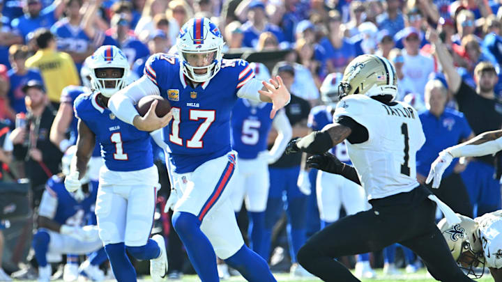 Sep 28, 2025; Orchard Park, New York, USA;  Buffalo Bills quarterback Josh Allen (17) runs for a gain past New Orleans Saints cornerback Alontae Taylor (1) during the fourth quarter