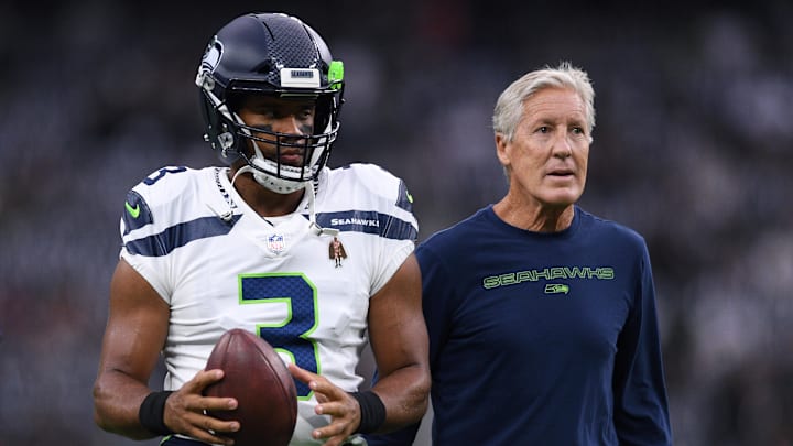 Seattle Seahawks quarterback Russell Wilson (3) and manager Pete Carroll (right) look on before the game against the Las Vegas Raiders at Allegiant Stadium.