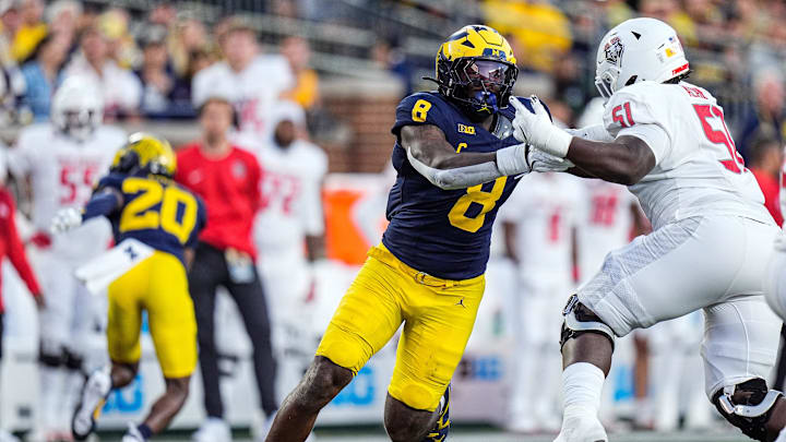 Michigan edge Derrick Moore (8) goes against New Mexico offensive lineman Malik Aliane (51) during the first half at Michigan Stadium in Ann Arbor on Saturday, August 30, 2025.