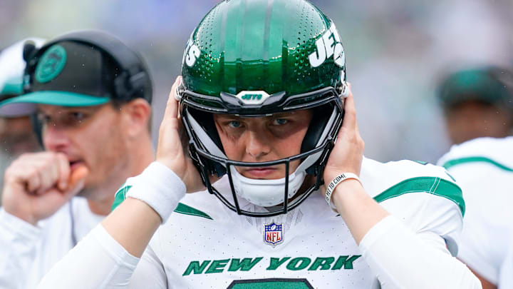 New York Jets quarterback Zach Wilson (2) puts on his helmet before walking onto the field to face