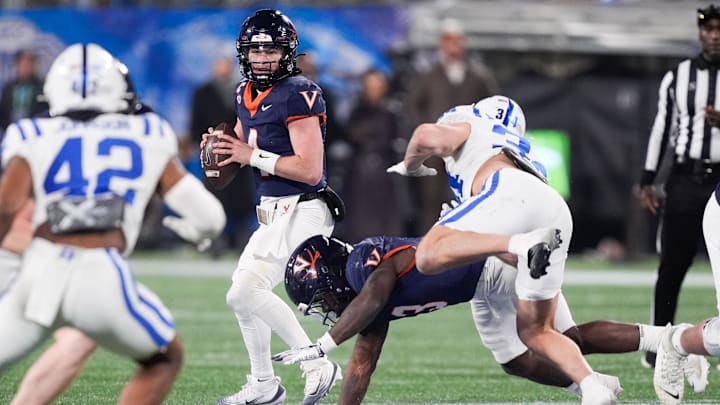 Dec 6, 2025; Charlotte, NC, USA; Virginia Cavaliers quarterback Chandler Morris (4) looks to pass in the second half against the Duke Blue Devils during the 2025 ACC Championship game at Bank of America Stadium. Mandatory Credit: Jim Dedmon-Imagn Images
