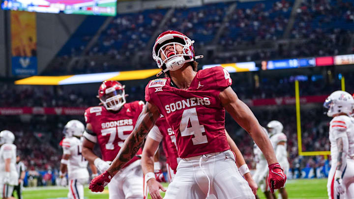 Dec 28, 2023; San Antonio, TX, USA;  Oklahoma Sooners wide receiver Nic Anderson (4) celebrates a touchdown catch in the first half against the Arizona Wildcats at Alamodome. Mandatory Credit: Daniel Dunn-Imagn Images
