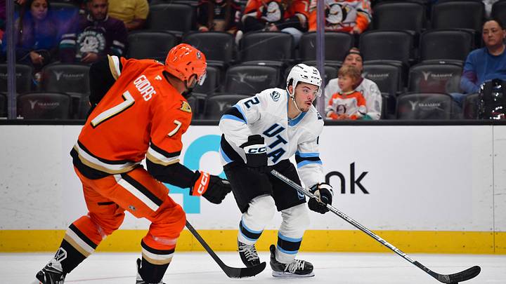 Sep 22, 2025; Anaheim, California, USA; Utah Mammoth center Tij Iginla (12) moves in for a shot against the defense of Anaheim Ducks defenseman Radko Gudas (7) during the first period at Honda Center. Mandatory Credit: Gary A. Vasquez-Imagn Images