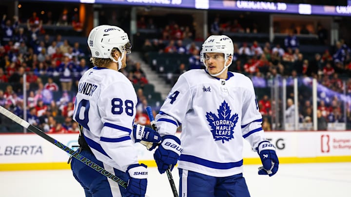 Feb 4, 2025; Calgary, Alberta, CAN; Toronto Maple Leafs right wing William Nylander (88) celebrates his goal with teammates against the Calgary Flames during the third period at Scotiabank Saddledome. Mandatory Credit: Sergei Belski-Imagn Images