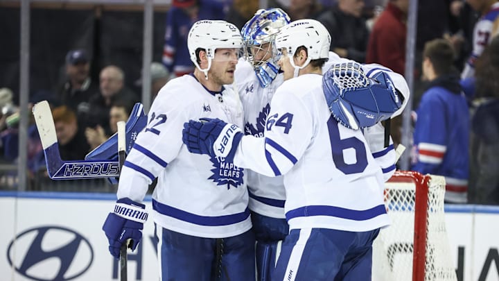 Feb 28, 2025; New York, New York, USA;  Toronto Maple Leafs goaltender Anthony Stolarz (41) celebrates with defenseman Jake McCabe (22) and center David Kampf (64) after defeating the New York Rangers at Madison Square Garden. Mandatory Credit: Wendell Cruz-Imagn Images
