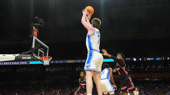 Apr 5, 2025; San Antonio, TX, USA; Duke Blue Devils guard Kon Knueppel (7) shoots against Houston Cougars guard Mylik Wilson (8) in the semifinals of the men's Final Four of the 2025 NCAA Tournament at the Alamodome. Mandatory Credit: Robert Deutsch-Imagn Images
