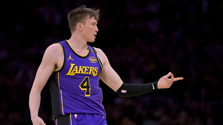 Apr 4, 2025; Los Angeles, California, USA;  Los Angeles Lakers guard Dalton Knecht (4) reacts after a 3-point basket in the first half against the New Orleans Pelicans at Crypto.com Arena. Mandatory Credit: Jayne Kamin-Oncea-Imagn Images