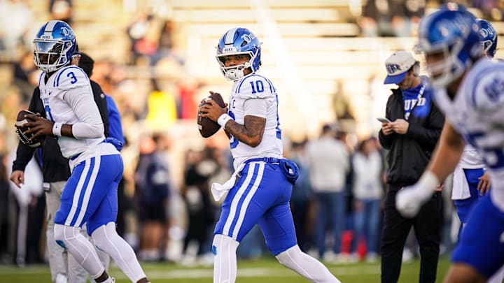 Nov 8, 2025; East Hartford, Connecticut, USA; Duke Blue Devils quarterback Darian Mensah (10) warms up before the start of the game against the UConn Huskies at Pratt & Whitney Stadium at Rentschler Field. 