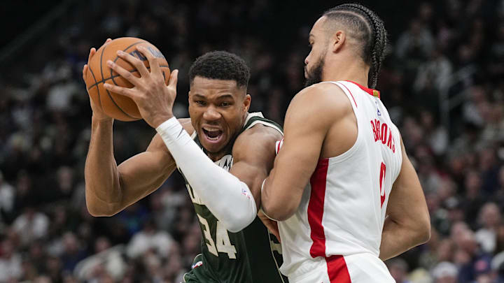 Nov 18, 2024; Milwaukee, Wisconsin, USA;  Milwaukee Bucks forward Giannis Antetokounmpo (34) drives for the basket against Houston Rockets forward Dillon Brooks (9) during the fourth quarter at Fiserv Forum. Mandatory Credit: Jeff Hanisch-Imagn Images