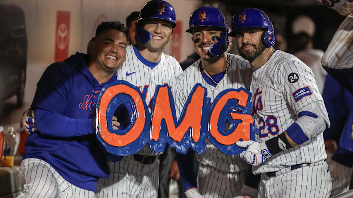 Aug 20, 2024; New York City, New York, USA;  New York Mets designated hitter J.D. Martinez (28) celebrates with infielder Jose Iglesias (11), left fielder Brandon Nimmo (9) and third baseman Mark Vientos (27) after hitting a three-run home run in the eighth inning against the Baltimore Orioles at Citi Field. Mandatory Credit: Wendell Cruz-Imagn Images