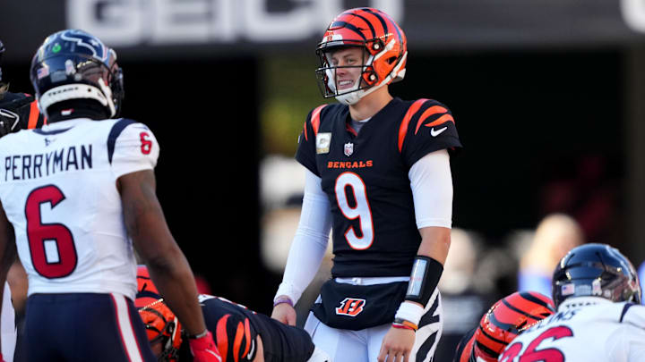 Nov 12, 2023; Cincinnati, Ohio, USA; Cincinnati Bengals quarterback Joe Burrow (9) smiles toward Houston Texans linebacker Denzel Perryman (6) on a fourth-down play in the second quarter of a Week 10 NFL football game between the Houston Texans and the Cincinnati Bengals at Paycor Stadium. Mandatory Credit: Kareem Elgazzar-Imagn Images