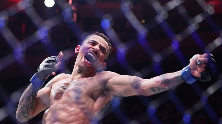 Nov 15, 2025; New York, NY, UNITED STATES; Carlos Prates (blue gloves) reacts after defeating Leon Edwards (not pictured) in the welterweight bout during UFC 322 at Madison Square Garden. Mandatory Credit: Ed Mulholland-Imagn Images