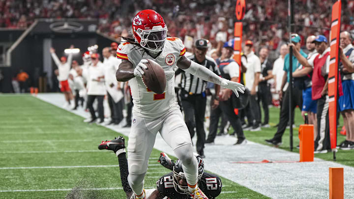 Sep 22, 2024; Atlanta, Georgia, USA; Kansas City Chiefs wide receiver Rashee Rice (4) scores a touchdown past Atlanta Falcons cornerback Dee Alford (20) during the first half at Mercedes-Benz Stadium. Mandatory Credit: Dale Zanine-Imagn Images