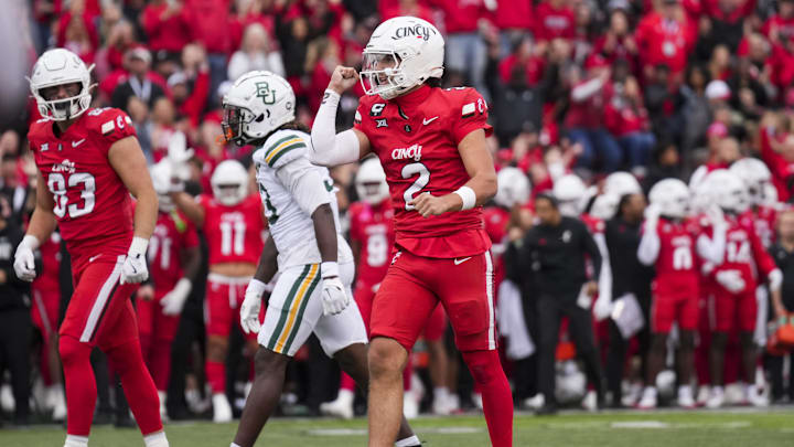 Oct 25, 2025; Cincinnati, Ohio, USA;  Cincinnati Bearcats quarterback Brendan Sorsby (2) celebrates the touchdown scored by running back Evan Pryor (6) against the Baylor Bears in the first half at Nippert Stadium. Mandatory Credit: Aaron Doster-Imagn Images