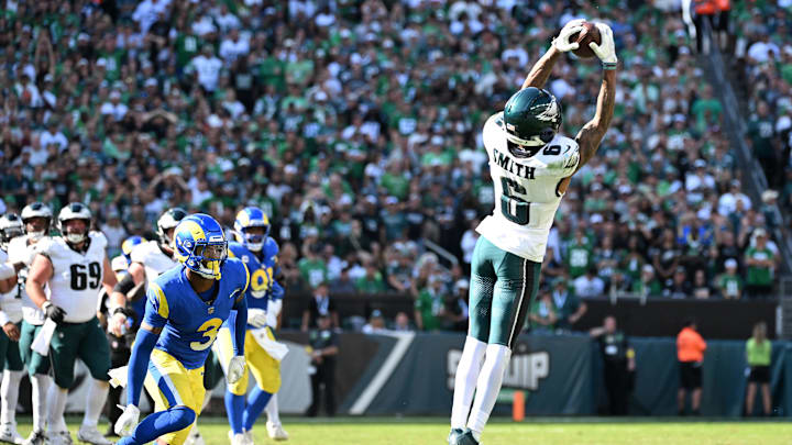 Sep 21, 2025; Philadelphia, Pennsylvania, USA;  Philadelphia Eagles linebacker Nolan Smith (3) games a catch against Los Angeles Rams safety Kam Curl (3) during the fourth quarter at Lincoln Financial Field. 
