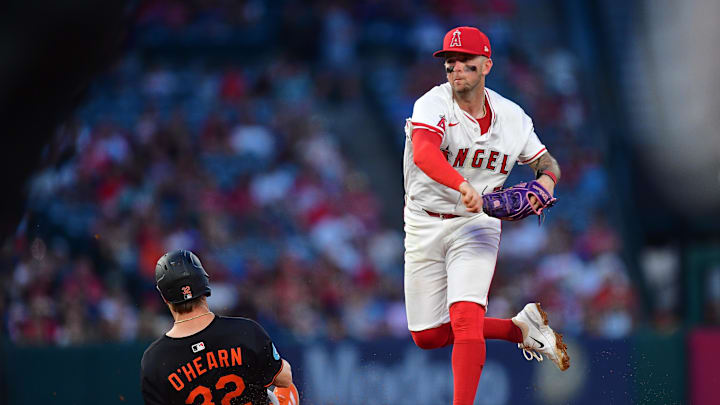 May 10, 2025; Anaheim, California, USA; Baltimore Orioles right fielder Ryan O'Hearn (32) is out at second as Los Angeles Angels shortstop Zach Neto (9) throws to first for the out against center fielder Cedric Mullins (31) during the fourth inning at Angel Stadium. Mandatory Credit: Gary A. Vasquez-Imagn Images May 10, 2025; Anaheim, California, USA; Baltimore Orioles right fielder Ryan O'Hearn (32) is out at second as Los Angeles Angels shortstop Zach Neto (9) throws to first for the out against center fielder Cedric Mullins (31) during the fourth inning at Angel Stadium. Mandatory Credit: Gary A. Vasquez-Imagn Images