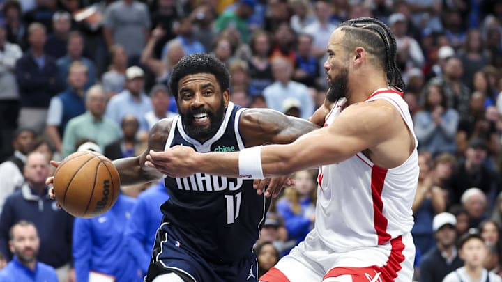 Oct 31, 2024; Dallas, Texas, USA;  Dallas Mavericks guard Kyrie Irving (11) drives to the basket as Houston Rockets forward Dillon Brooks (9) defends during the second half at American Airlines Center. Mandatory Credit: Kevin Jairaj-Imagn Images