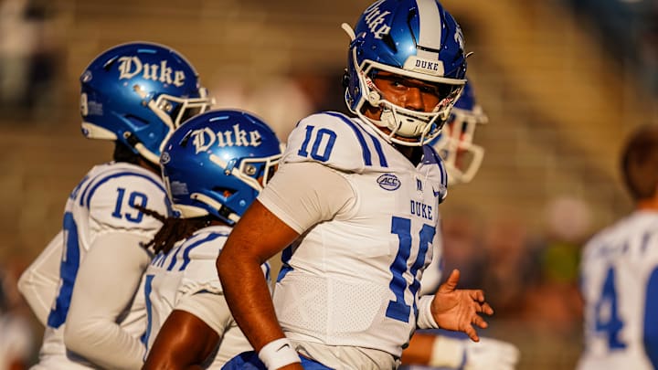 Nov 8, 2025; East Hartford, Connecticut, USA; Duke Blue Devils quarterback Darian Mensah (10) warms up before the start of the game against the UConn Huskies at Pratt & Whitney Stadium at Rentschler Field. Mandatory Credit: David Butler II-Imagn Images