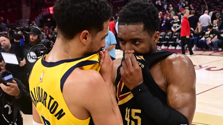 May 13, 2025; Cleveland, Ohio, USA; Indiana Pacers guard Tyrese Haliburton (0) talks to Cleveland Cavaliers guard Donovan Mitchell (45) after game five of the second round for the 2025 NBA Playoffs at Rocket Arena. Mandatory Credit: Ken Blaze-Imagn Images