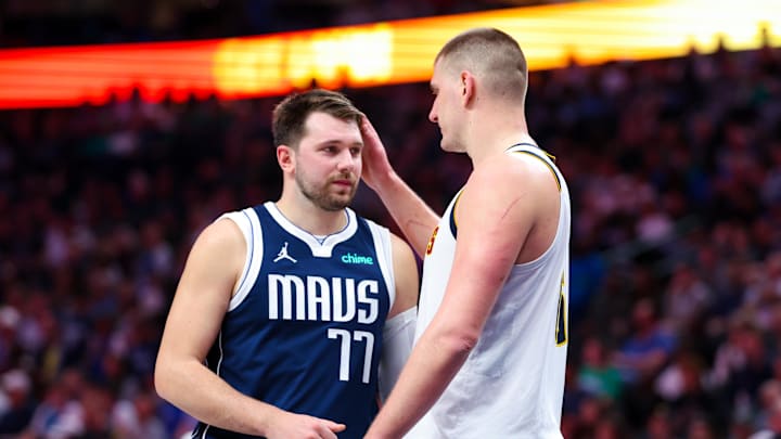 Mar 17, 2024; Dallas, Texas, USA;  Dallas Mavericks guard Luka Doncic (77) speaks with Denver Nuggets center Nikola Jokic (15) during the second half at American Airlines Center. Mandatory Credit: Kevin Jairaj-USA TODAY Sports