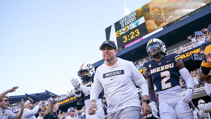 Sep 7, 2024; Columbia, Missouri, USA; Missouri Tigers head coach Eli Drinkwitz runs out with the team against the Buffalo Bulls prior to a game at Faurot Field at Memorial Stadium. Mandatory Credit: Denny Medley-Imagn Images
