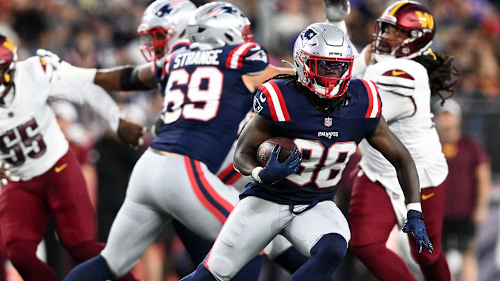 Aug 8, 2025; Foxborough, Massachusetts, USA; New England Patriots running back Rhamondre Stevenson (38) runs against the Washington Commanders during the first half at Gillette Stadium. Mandatory Credit: Brian Fluharty-Imagn Images
