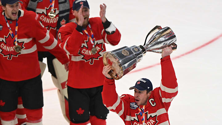 Feb 20, 2025; Boston, MA, USA; [Imagn Images direct customers only]  Team Canada forward Sidney Crosby (87) lifts the 4 Nations Face-Off trophy after winning against Team USA in overtime  during the 4 Nations Face-Off ice hockey championship game at TD Garden. Mandatory Credit: Brian Fluharty-Imagn Images