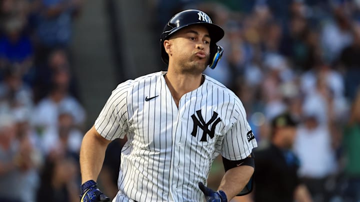 Mar 11, 2026; Tampa, Florida, USA;  New York Yankees designated hitter Giancarlo Stanton (27) hits a 2-run home run during the third inning against the Toronto Blue Jays at George M. Steinbrenner Field. Mandatory Credit: Kim Klement Neitzel-Imagn Images