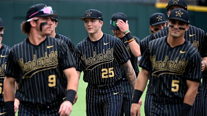 Vanderbilt's Mack Whitcomb (25) walks back to the dugout with teammate before their game against Texas at Hawkins Field on Friday, April 24, 2026, in Nashville, Tenn. Vanderbilt's Mack Whitcomb (25) walks back to the dugout with teammate before their game against Texas at Hawkins Field on Friday, April 24, 2026, in Nashville, Tenn.