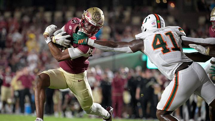Oct 4, 2025; Tallahassee, Florida, USA; Florida State Seminoles wide receiver Micahi Danzy (19) runs against Miami Hurricanes linebacker Chase Smith (41) during the second half at Doak S. Campbell Stadium. Mandatory Credit: Melina Myers-Imagn Images Oct 4, 2025; Tallahassee, Florida, USA; Florida State Seminoles wide receiver Micahi Danzy (19) runs against Miami Hurricanes linebacker Chase Smith (41) during the second half at Doak S. Campbell Stadium. Mandatory Credit: Melina Myers-Imagn Images