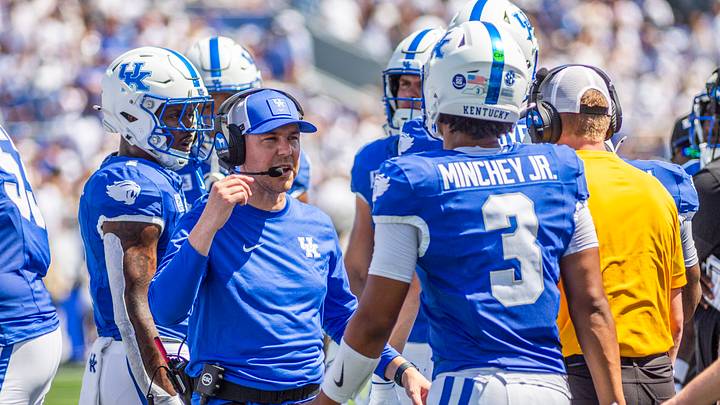 Sep 5, 2026; Lexington, Kentucky, USA; Kentucky Wildcats head coach Will Stein talks to Kentucky Wildcats quarterback Kenny Minchey (3) during a time out during the first quarter against the Youngstown State Penguins at Kroger Field. Mandatory Credit: Arden Barnes-Imagn Images Sep 5, 2026; Lexington, Kentucky, USA; Kentucky Wildcats head coach Will Stein talks to Kentucky Wildcats quarterback Kenny Minchey (3) during a time out during the first quarter against the Youngstown State Penguins at Kroger Field. Mandatory Credit: Arden Barnes-Imagn Images