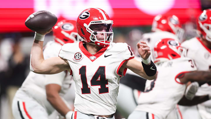 Dec 6, 2025; Atlanta, GA, USA; Georgia Bulldogs quarterback Gunner Stockton (14) throws a pass during the fourth quarter against the Alabama Crimson Tide during the 2025 SEC Championship game at Mercedes-Benz Stadium. Mandatory Credit: Brett Davis-Imagn Images