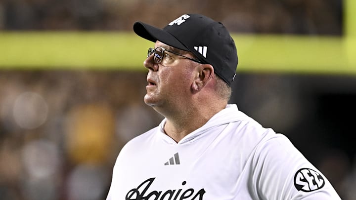 Oct 26, 2024; College Station, Texas, USA; Texas A&M Aggies head coach Mike Elko watches the replay in the third quarter against the LSU Tigers at Kyle Field. Mandatory Credit: Maria Lysaker-Imagn Images. 