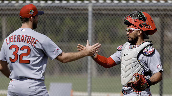Feb 16, 2026; Jupiter, FL, USA; St. Louis Cardinals catcher Iván Herrera (right) and pitcher Matthew Liberatore (32) shake hands after pitching drills during spring training workouts at Roger Dean Stadium. Mandatory Credit: Reinhold Matay-Imagn Images Feb 16, 2026; Jupiter, FL, USA; St. Louis Cardinals catcher Iván Herrera (right) and pitcher Matthew Liberatore (32) shake hands after pitching drills during spring training workouts at Roger Dean Stadium. Mandatory Credit: Reinhold Matay-Imagn Images