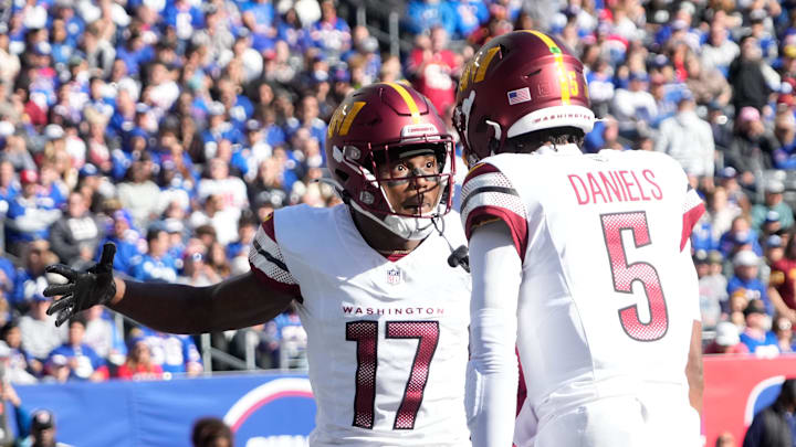 Nov 3, 2024; East Rutherford, New Jersey, USA; Washington Commanders wide receiver Terry McLaurin (17) after a 1st quarter towchdown reception from quarterback Jayden Daniels (5) against the New York Giants at MetLife Stadium. Mandatory Credit: Robert Deutsch-Imagn Images
