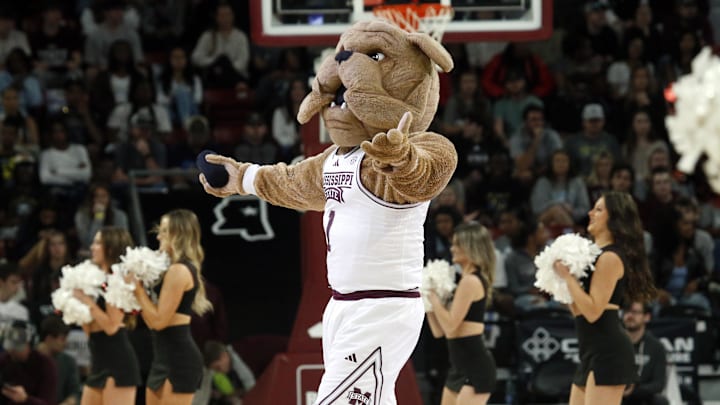 Mississippi State Bulldogs mascot Bully tosses t-shirts into the crowd during a time out during the first half against the Southern Jaguars at Humphrey Coliseum.