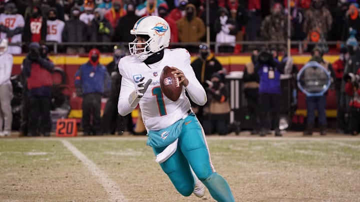 Jan 13, 2024; Kansas City, Missouri, USA; Miami Dolphins quarterback Tua Tagovailoa (1) moves out to