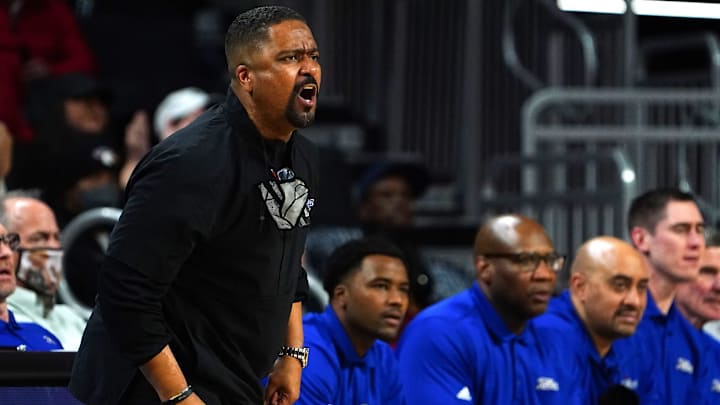 Tulsa Golden Hurricane head coach Frank Haith instructs the team in the second half of an NCAA men's college basketball game against the Cincinnati Bearcats Tulsa Golden Hurricane head coach Frank Haith instructs the team in the second half of an NCAA men's college basketball game against the Cincinnati Bearcats