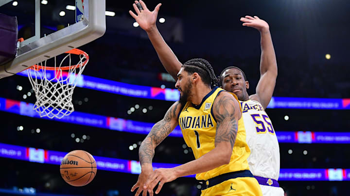 Feb 8, 2025; Los Angeles, California, USA; Indiana Pacers forward Obi Toppin (1) passes the ball against Los Angeles Lakers center Trey Jemison III (55) during the first half at Crypto.com Arena. Mandatory Credit: Gary A. Vasquez-Imagn Images