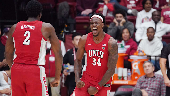 UNLV Runnin' Rebels center Emmanuel Stephen (34) celebrates with UNLV Runnin' Rebels forward Kimani Hamilton (2) after a basket at the buzzer at the end of the first half at Maples Pavilion. Mandatory Credit: David Gonzales-Imagn Images